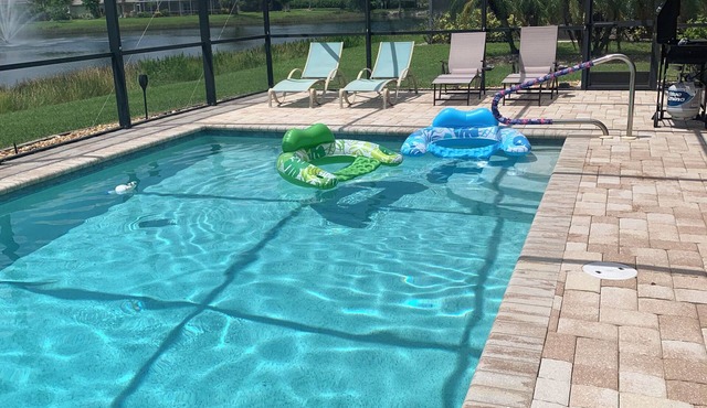 Enjoy amazing sunsets over the lake with private, heated pool. Quiet subdivision