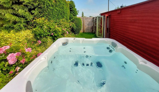 Enjoy an unforgettable time in this idyllically located vacation home with outdoor hot tub.