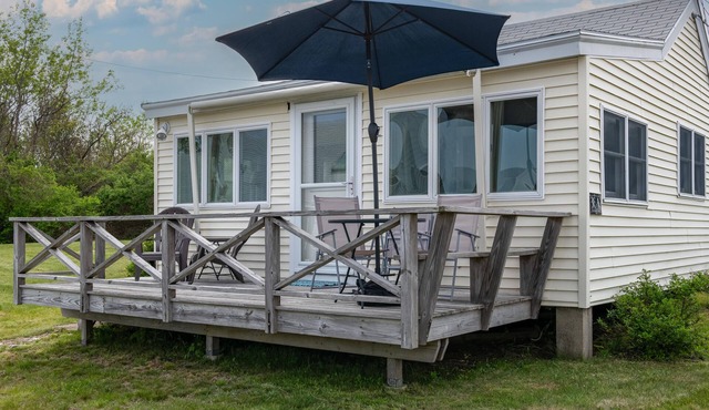 Enjoy beautiful easterly views of Casco Bay from this charming 1BR cottage