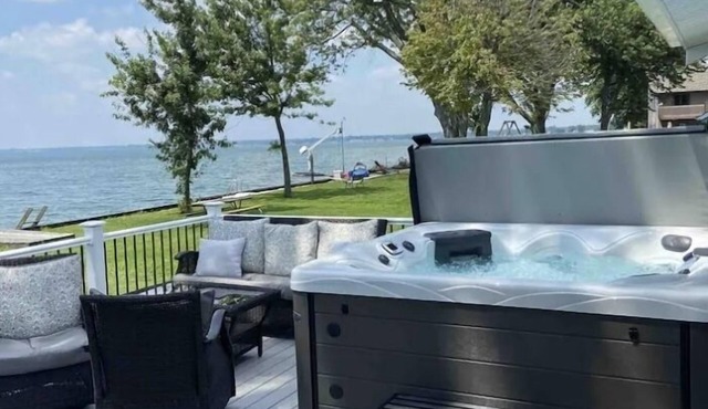 Enjoy Beautiful Sunsets at this Lake House w a HOT TUB, Boat Garage and Game Rm