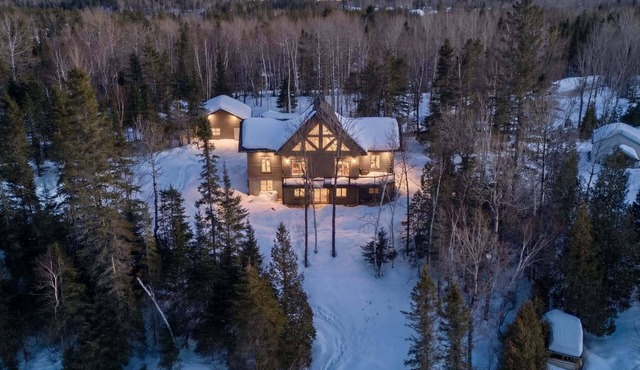 Enjoy our cozy waterfront chalet with a private hot tub, stunning views,
