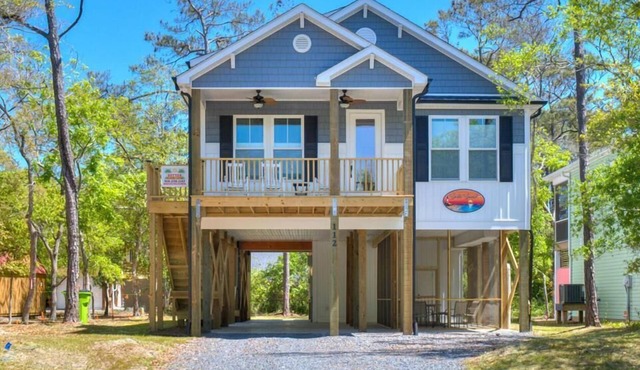 Enjoy coastal living at A Siesta Sunset, a spacious 3-bedroom haven in Oak Island!