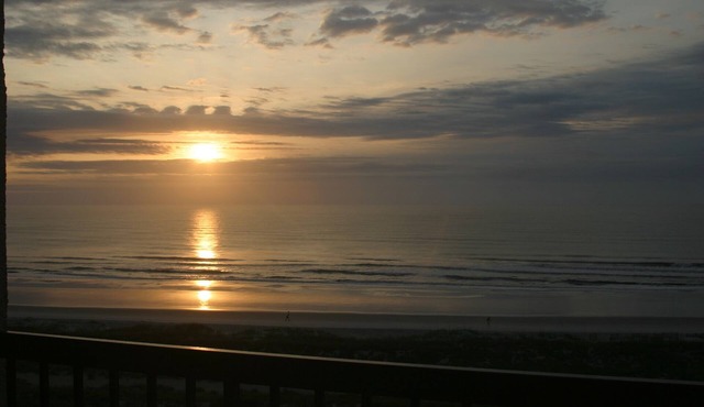 Enjoy Corner Office Beach Views In This Top Floor Condominium