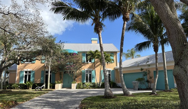 Enjoy our waterfront home with private beach access & boat dock in The Moorings!
