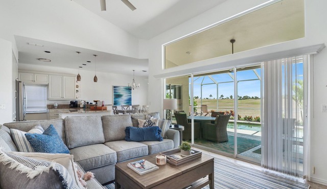 Enjoy Players Club Access in this Luxurious Naples Golf Course Home.