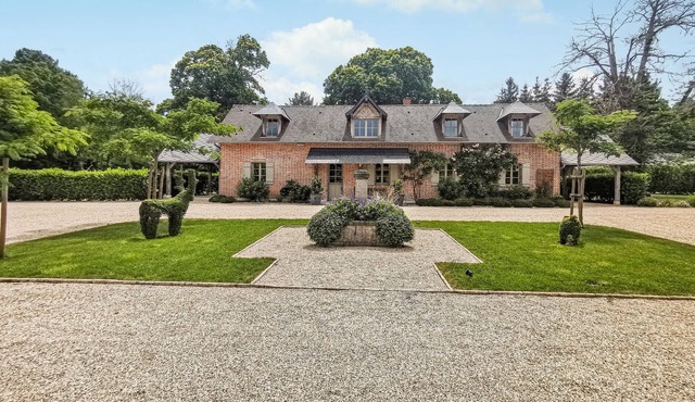 Enjoy privacy and luxury in this villa on a beautiful estate.