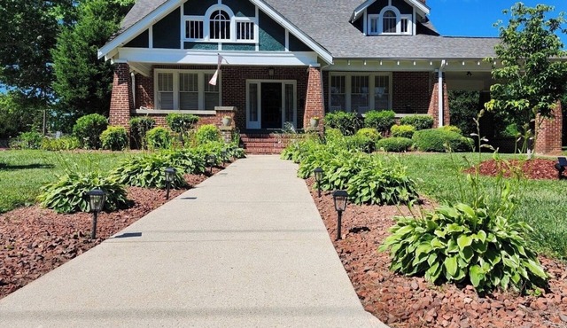 Enjoy small-town, Main Street from the front porch of this historic bungalow!