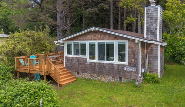 Enjoy the large deck with wooded ocean views.