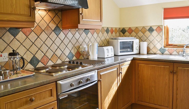 Enjoy the magnificent views and a holiday in the countryside from this attractive barn conversion cl