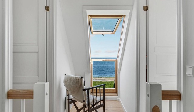 Enjoy the sea breeze on the terrace of this spacious vacation home.