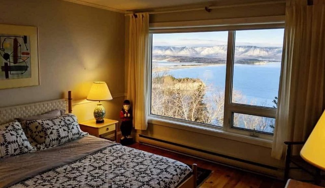 Enjoy the stunning views of the Cape Breton Highlands atop this cliffside estate