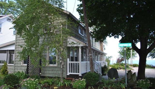 Enjoy the View From this Charming Lakefront House in Private Park