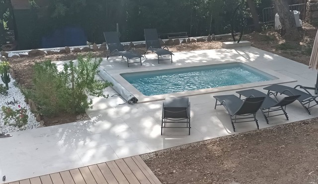Enjoy this large family home in a quiet wooded setting.