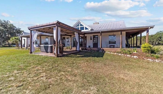 Enjoy total privacy on a fully fenced 25-acre luxury ranch retreat of 5100sqft