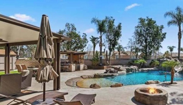 Enjoyable 4-bedroom house with a beautiful rock water fall slide swimming pool.