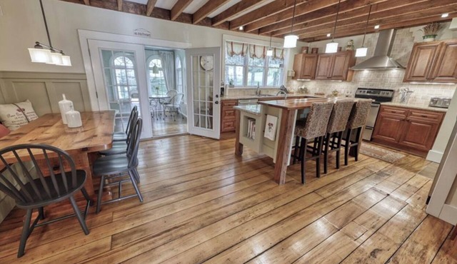 Entertain in this 4 bedroom farmhouse with hot tub