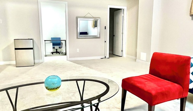 Entire basement with large windows, private full bathroom and office