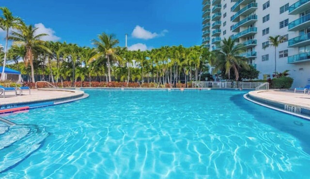Entire condominium with a pool view, steps from the beach