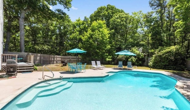 Escape and Relax in this East Orleans home with magnificent in-ground heated pool