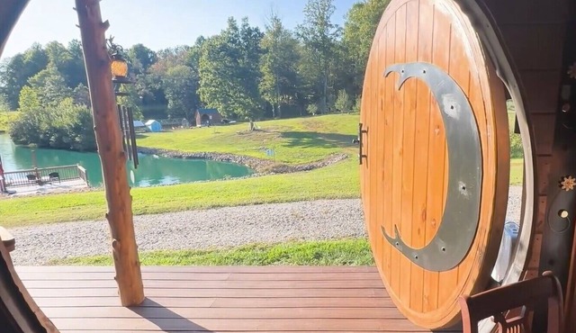 Escape to a Hobbit cottage overlooking a pond with water wheel in wine country!