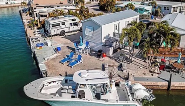 Escape to an oceanfront Home with Boat Dock + pickleball, Pool and more!