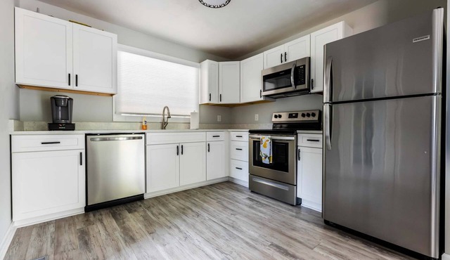 Escape to Sunset Cove, a serene lakeside retreat with modern comforts, stunning views
