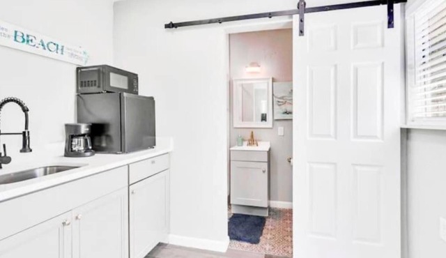 Escape to the ultimate beach vacation at The Palm Tree Bliss Beach Bungalow!