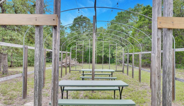 Escape to this beautifully remodeled farmhouse on private, open green space.