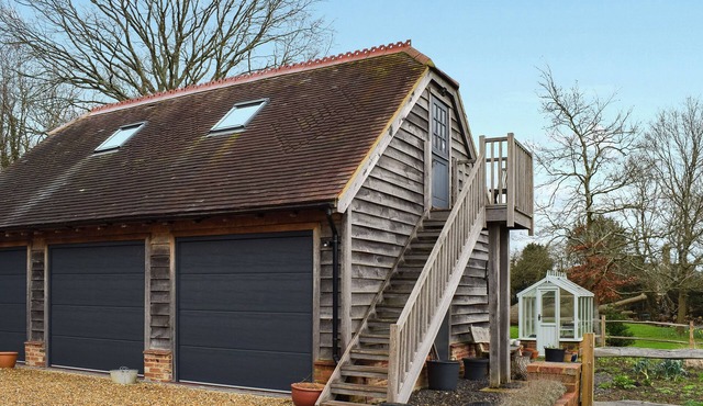 Escape to this enchanting studio apartment set above a barn.