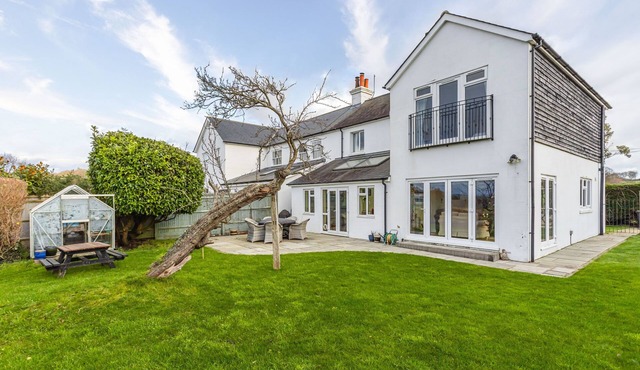 Escape to this spacious four-bedroom retreat