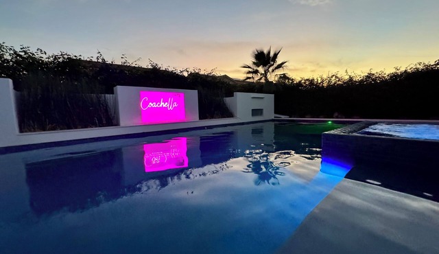 Escape to this newly remodeled 7-bedroom desert retreat designed for relaxation and fun. Enjoy a large resort-style pool and spa, a fully stocked kitchen, spacious game room, and outdoor games perfect for group play under endless blue skies. Whether