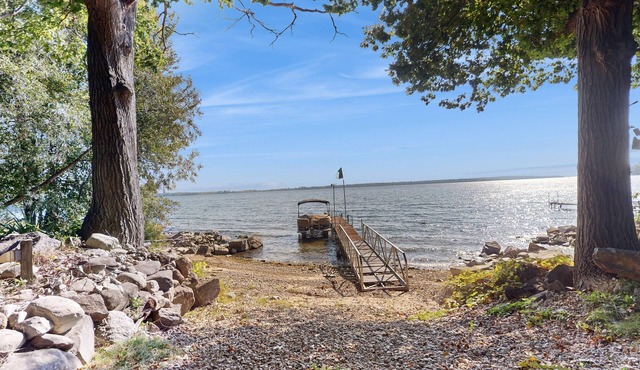 Escape to this spacious lakefront retreat with W/D, AC, firepit, & grill