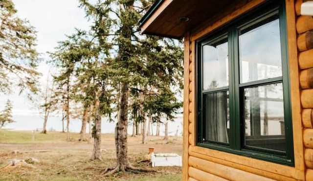 Escape to Tranquility at The Sandy Pearl: A Cozy Log Cottage Retreat