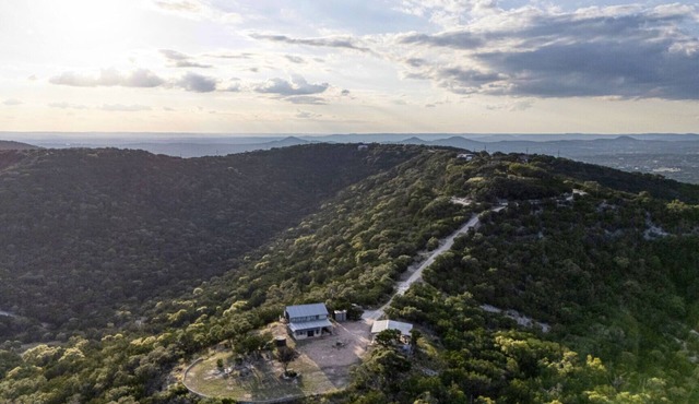 Escape to your private sanctuary nestled atop a serene hill with amazing views.
