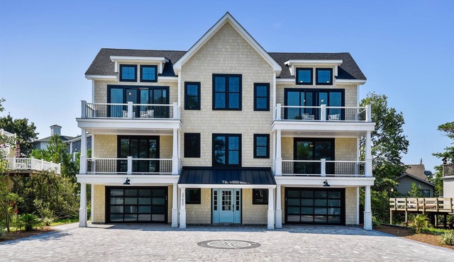 Exceptional beach home located just steps from the beach front in beautiful family friendly Ocean Village, one of North Bethanyâ€™s most sought after private gated communities!