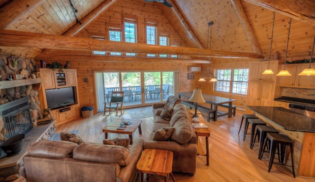 Exceptional log home on 9+ acres with frontage on Big St. Germain Lake