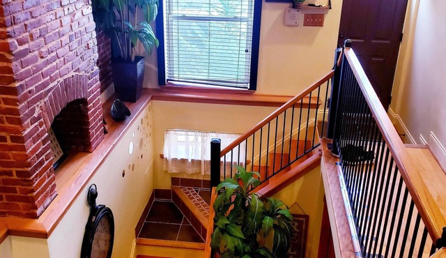Exclusive Sunken Living Room Soaring Exposed Brick