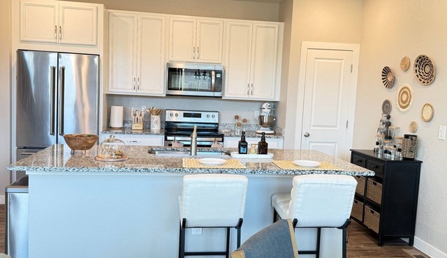 Executive furnished 4BR/4BA townhouse for 30+ day stays with 2-car garage