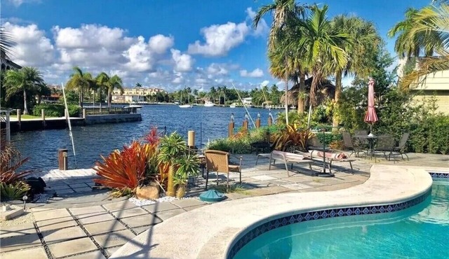 Executive Waterfront Gem with Ocean Access & Tropical Pool Oasis