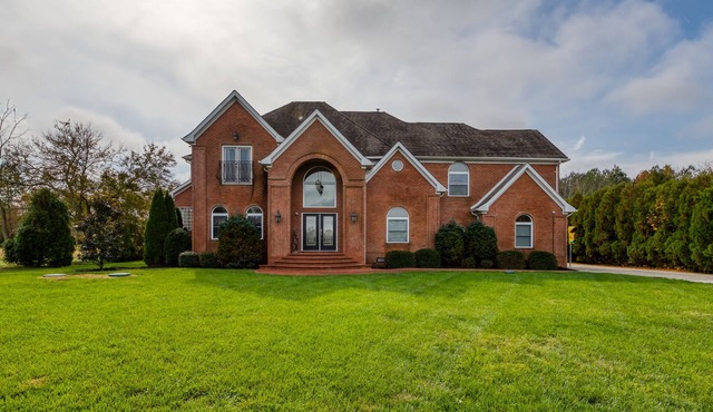 Expansive estate with pool, basketball court, & wet bar