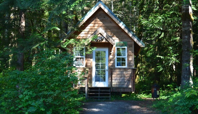 Experience a custom built tiny home cabin near Mt Rainier National Park. It sleeps up to three! Firepit, access to shared hot tub, walking distance to Copper Creek Restaurant