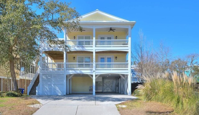 Experience beachfront bliss at Incommunicado, a spacious 4-bedroom home in Oak Island.