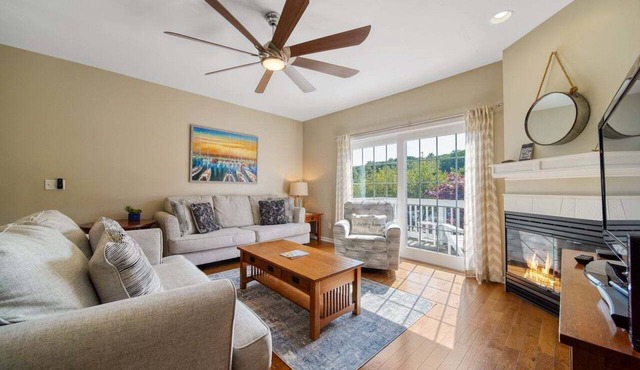 Experience comfort in this 3-bedroom townhome with stunning water views in downtown Saugatuck.