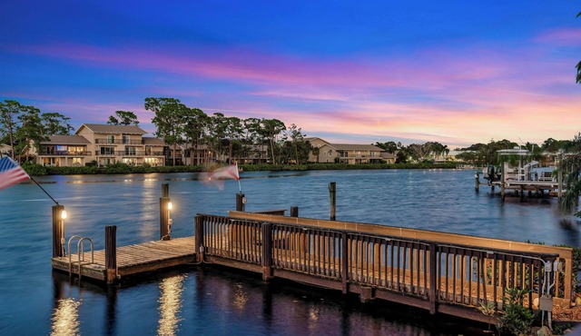 Experience island living at its finest in this private Jupiter River Estate