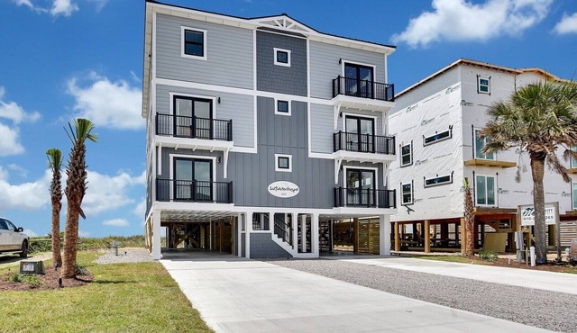 Experience luxury at Saltwater Gospel, a stunning 13-bedroom oceanfront retreat in Oak Island!