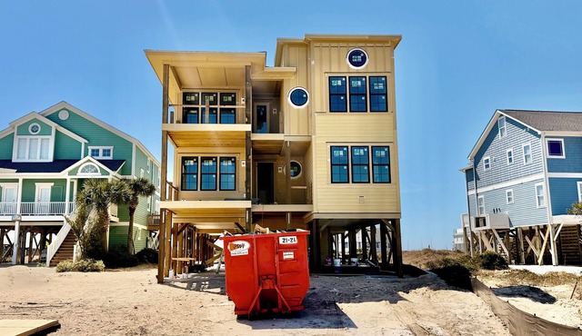 Experience luxury at 'Zen' - a stunning 13-bedroom oceanfront house in Oak Island.