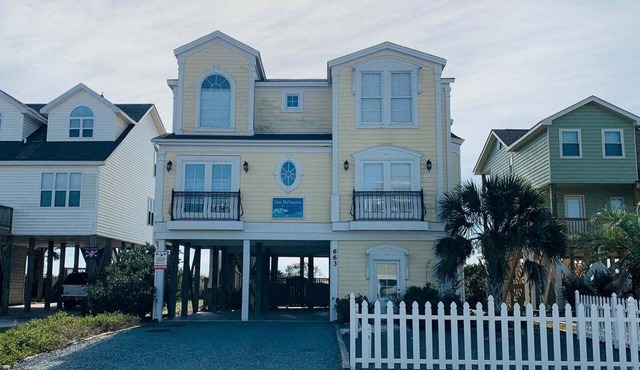 Experience oceanfront bliss at Inn Between, a spacious 6-bedroom getaway in Holden Beach.