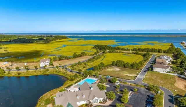 Experience The Beauty & Luxury Of This Townhome Located in A Resort Community