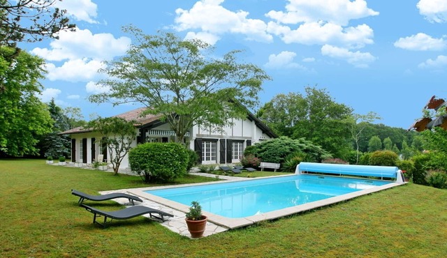 Experience this Basque Style Retreat with Charming Gardens and Heated Pool