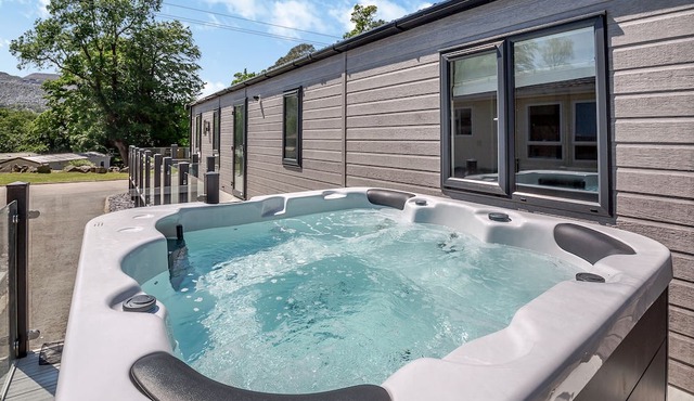 Experience ultimate luxury with the brand-new Faraday lodge with hot tub.